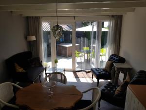 Posezení v ubytování B&B Het Zwanennest