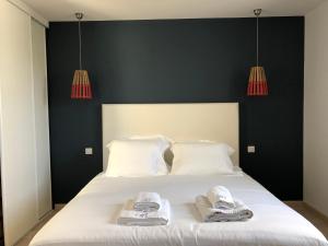 Postel nebo postele na pokoji v ubytování Roscoff Beach House