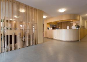 a lobby with a reception desk in a building at Hotel Meira in Vila Praia de Âncora