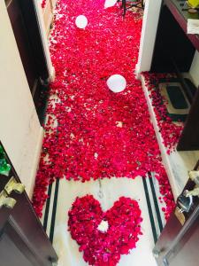 a room filled with red hearts on the floor at Krishna Palace - A Heritage Hotel in Jaipur