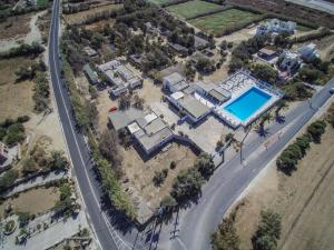 an aerial view of a house with a swimming pool at Hostel Naxos Camping in Naxos Chora