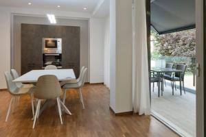 a kitchen and dining room with a table and chairs at Central STEMA Luxury in Misano Adriatico