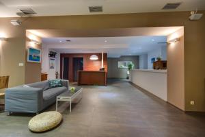 a living room with a couch and a table at B&B Galija in Crikvenica