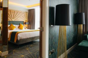 Voodi või voodid majutusasutuse Iveagh Garden Hotel toas