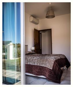 Villa 4 étoiles Sole di Corsica tesisinde bir odada yatak veya yataklar