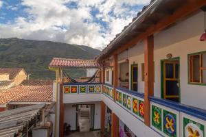 a view from the balcony of a house with colorful walls at Hostal El Caminante in El Cocuy