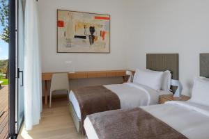 Postel nebo postele na pokoji v ubytování Six Senses Kaplankaya