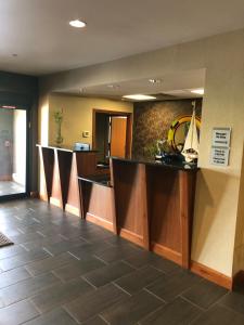 a lobby with a bar in a hotel at Countryview Inn & Suites in Robinson