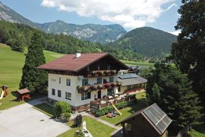 an aerial view of a house in the mountains at Appartments am Esslgut in Haus im Ennstal