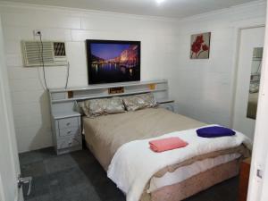 Ένα ή περισσότερα κρεβάτια σε δωμάτιο στο Burt St gardens