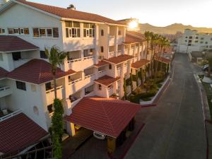 arial view of a street with houses and trees at Bahia Hotel & Beach House in Cabo San Lucas