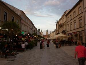 a city street with people walking down a street at Staszica Centrum in Lublin