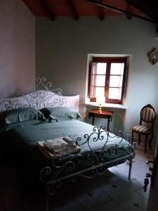 Postel nebo postele na pokoji v ubytování B&B Villa Tonelli