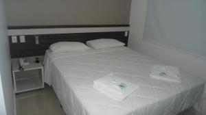 Postel nebo postele na pokoji v ubytování San Lucas Hotel