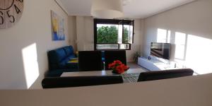 a living room with a couch and a table at Apartamento ENTREVIÑAS en el corazón de La Rioja in Fuenmayor