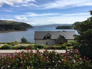 a house with a view of a body of water at Woodlands in Portree