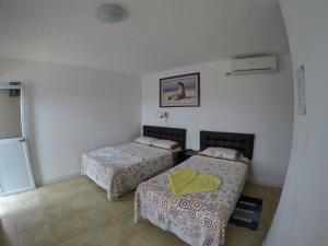 Rúm í herbergi á Stefany's Lodging