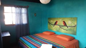 Posteľ alebo postele v izbe v ubytovaní Galapagos Morning Glory