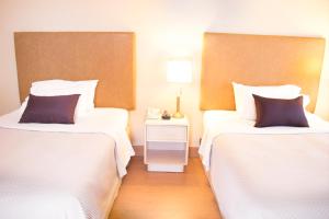 Postel nebo postele na pokoji v ubytování iStay Hotel Ciudad Juarez
