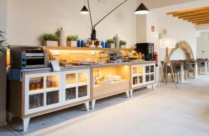 
a kitchen filled with lots of different types of pastries at Forum Boutique Hotel & Spa - Adults Only in Alcudia

