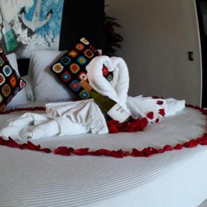 En eller flere senge i et værelse på Bahia Tolok