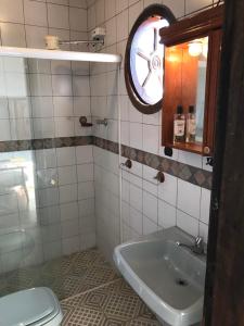 a bathroom with a toilet and a sink at Guest house with stunning view in Rio de Janeiro