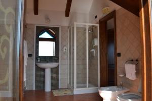 a bathroom with a sink and a toilet and a shower at Luna D'Agerola in Agerola +37 photos