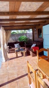 a patio with couches and a table and a couch at El vivero in Chiclana de la Frontera