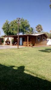 a house with a grass field in front of it at El Vivero in Chiclana de la Frontera +35 photos