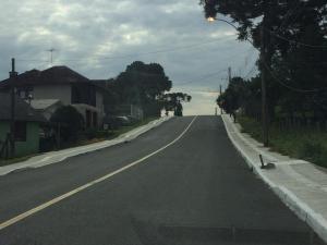 an empty street in a residential neighborhood with aillance at Residencial Quatro Estações in Canela