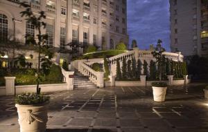A garden outside The Bellezza Hotel Suites