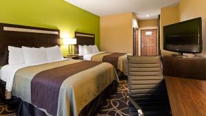 Postel nebo postele na pokoji v ubytování Best Western Plus Kenedy Inn
