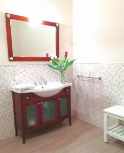 a bathroom with a sink and a mirror at Adeste 33 in Scicli +57 photos