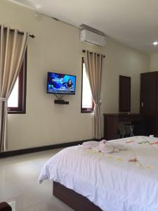 TV a/nebo společenská místnost v ubytování D'Batur Hotel