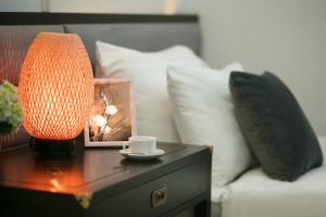 Voodi või voodid majutusasutuse Golden Rooster Hotel toas