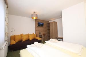 Postel nebo postele na pokoji v ubytování Lärchenheim Apartments