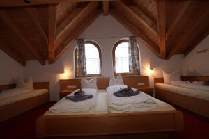 Postel nebo postele na pokoji v ubytování Lärchenheim Apartments