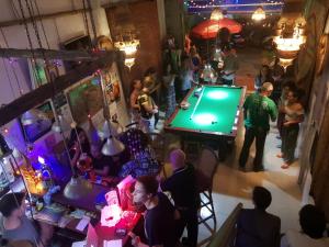 an overhead view of a pool table in a bar at Ganesha Hostel in Battambang