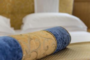 Postel nebo postele na pokoji v ubytování Hotel & Terme Bagni di Lucca
