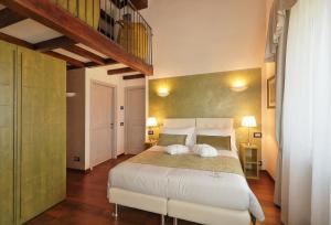 Säng eller sängar i ett rum på RELAIS VAL D'ORCIA