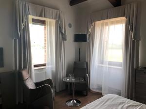 A bed or beds in a room at RELAIS VAL D'ORCIA