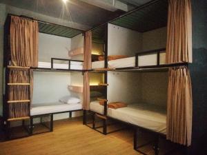 Ένα ή περισσότερα κρεβάτια σε δωμάτιο στο PINX'S HOSTEL