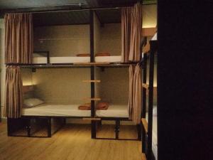 Voodi või voodid majutusasutuse PINX'S HOSTEL toas