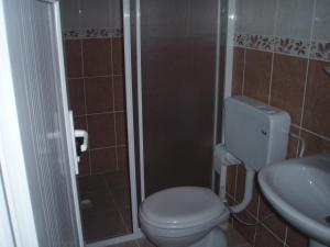 a bathroom with a toilet and a sink at Hotel Pamukkale in Pamukkale