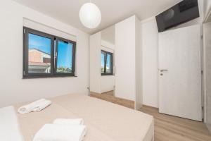 Televízia a/alebo spoločenská miestnosť v ubytovaní Luxury Apartments VilaMaloca