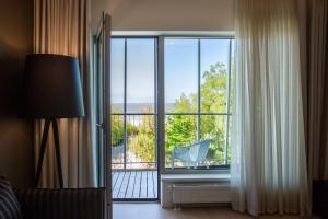 TV a/nebo společenská místnost v ubytování Hedon Spa & Hotel