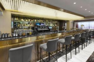 a bar with a row of chairs at a restaurant at InterContinental Sofia by IHG in Sofia