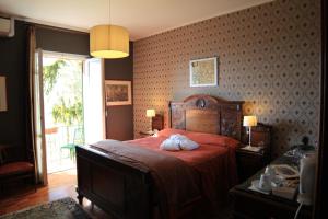 Un pat sau paturi într-o cameră la Felicin - Ristorante Albergo "Dimora Storica"