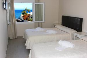 Cama o camas de una habitación en H Rincón de Diego
