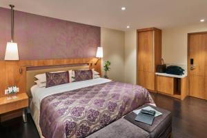 Postel nebo postele na pokoji v ubytování Hotel Bawa International + 31 fotografií